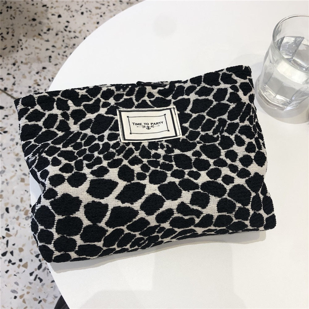 Necessär med leopard- och zebramönster